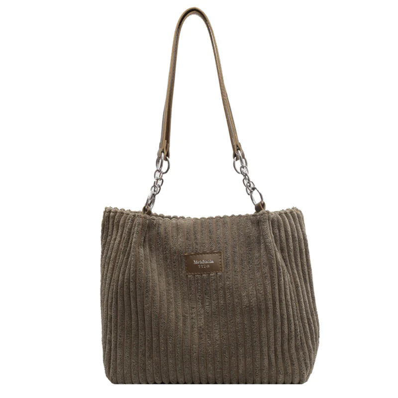 Olive green corduroy shoulder tote bag with textured finish and dual shoulder straps, perfect for everyday use with a vintage flair.