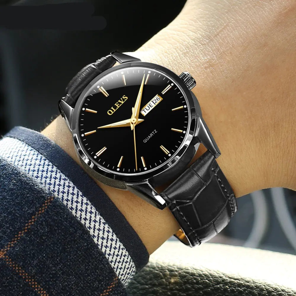 Quartz Couple Watches - Men's Mechanical Dual Calendar with black dial and leather strap, worn on wrist for a stylish formal look.
