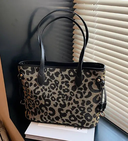 Shoulder Tote Bag with black leather straps and leopard print design, ideal for stylish everyday use with large capacity storage.