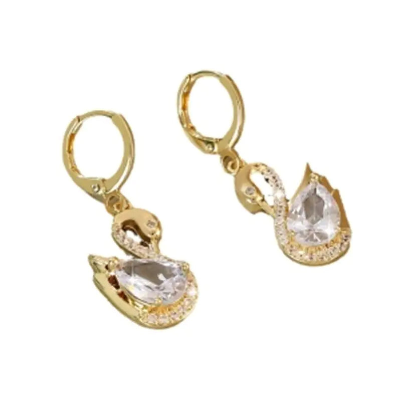 European Style Luxury Temperament Copper Zirconium Swan Pendant Earrings with teardrop zircon stones and gold alloy, laid flat for detail view.