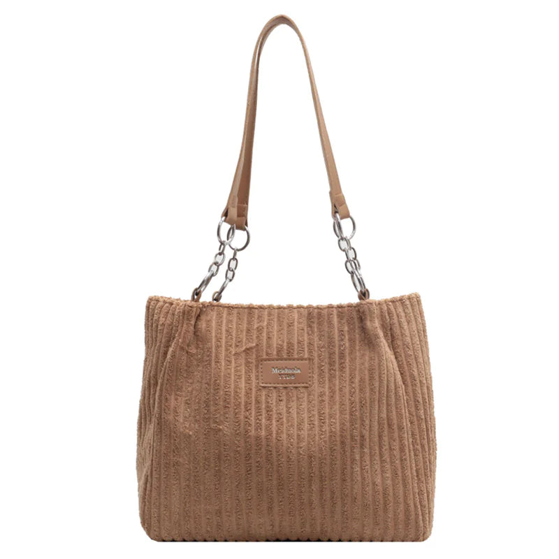 Brown corduroy shoulder tote bag with dual chain and leather handles, offering a roomy interior and retro charm for everyday essentials.