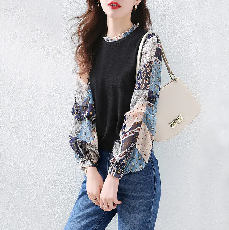 Puff Sleeve Printed Stitching Two-Piece Sweater featuring a black bodice with colorful patchwork puff sleeves, styled with blue jeans for a chic casual look.