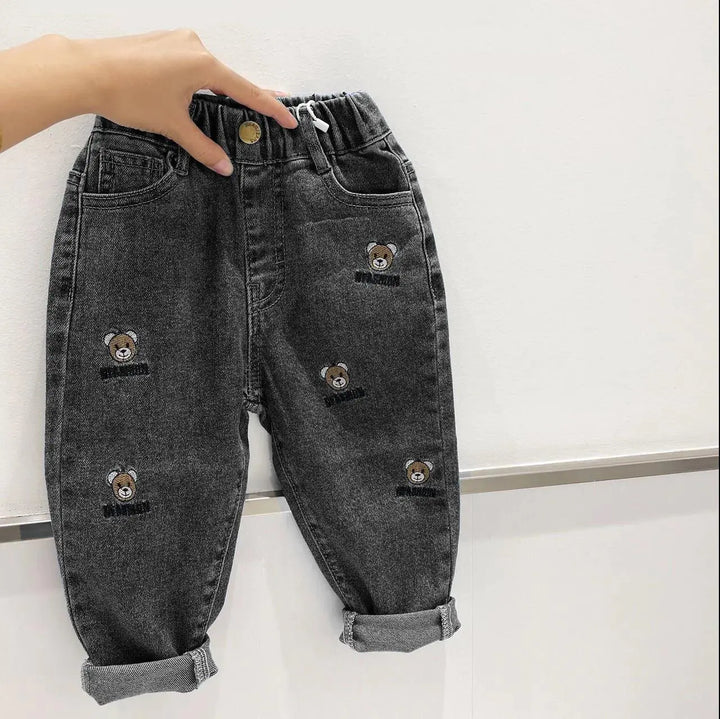Black denim kids' casual all-match long pants featuring cute teddy bear embroidery, perfect for stylish and playful daily outfits.