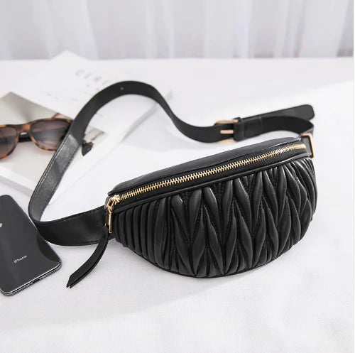 Luxury Designer Women's Leather Waist and Shoulder Bag in black with quilted texture and gold zipper, ideal for modern fashion-forward styling.