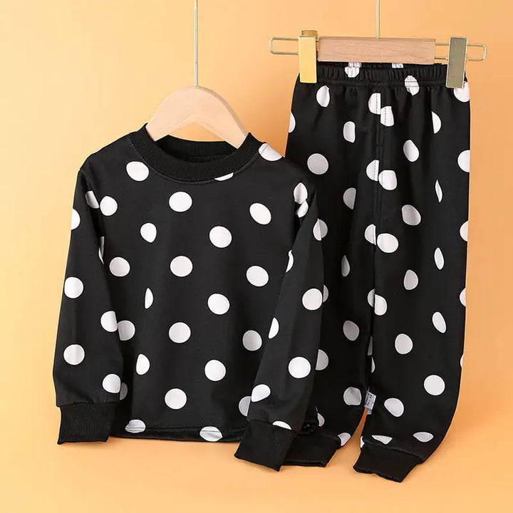 Warm red boys' pajama set with green and white polka dots, long sleeves and soft lining, perfect for cozy nights for kids aged 3-8.