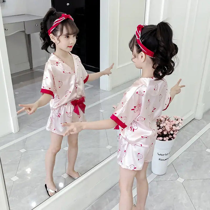 Girls Summer Cartoon Pajama Set with red heart print and matching headband, perfect for warm nights and stylish sleepwear looks.
