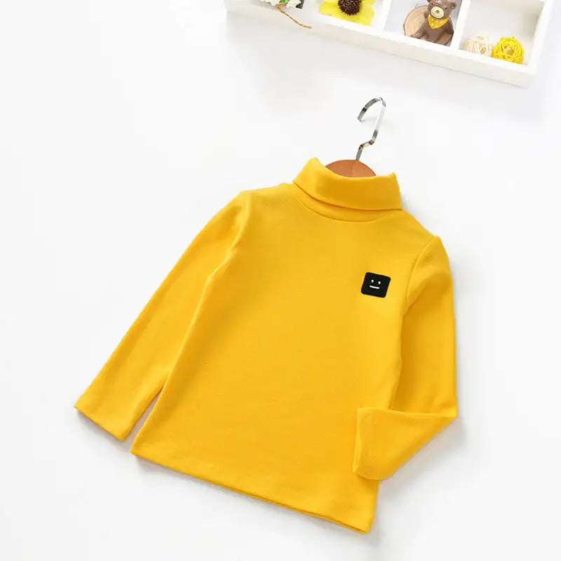 New Baby Long-Sleeved T-Shirt for Kids' Tops in bright yellow with a cute black face patch, ideal for year-round comfort and style.