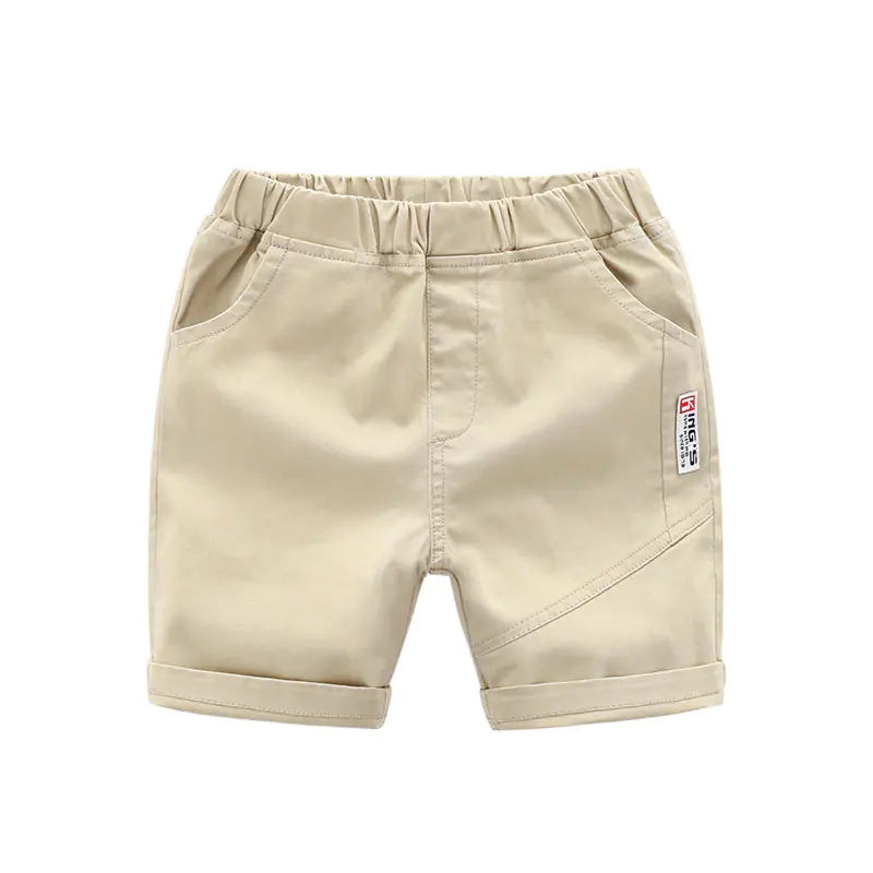 Beige trendy summer casual pants for kids aged 3 to 8, made from breathable 98% cotton with rolled cuffs and side pockets.