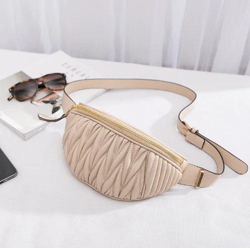 Beige Luxury Designer Women's Leather Waist and Shoulder Bag featuring a quilted design and adjustable strap, blending elegance with practicality.